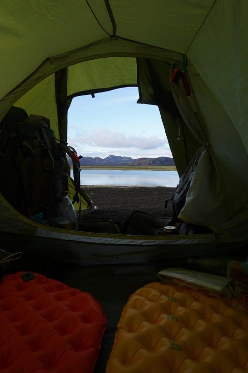 Comfy evening in our tent next to the lake.